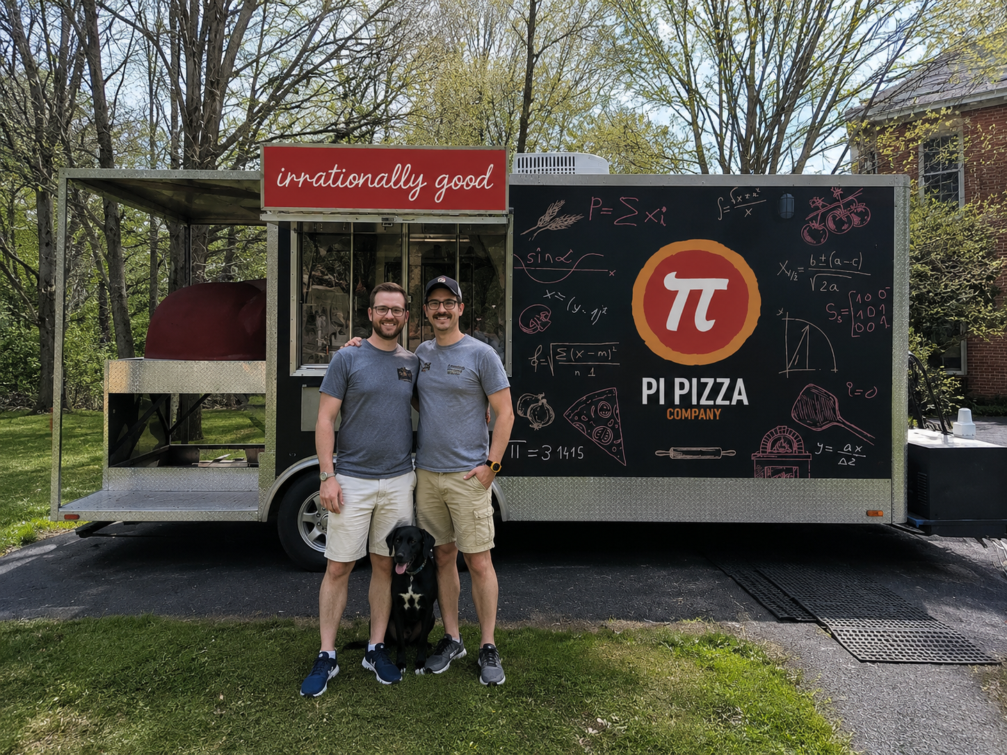 Willie and Jonathan, the owners of Pi Pizza Company, with their dog in front of the food truck at Fibonacci Brewing
